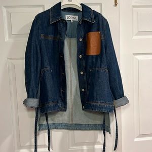 Loewe denim jacket with leather anagram pocket. 2 color denims and ties on sides